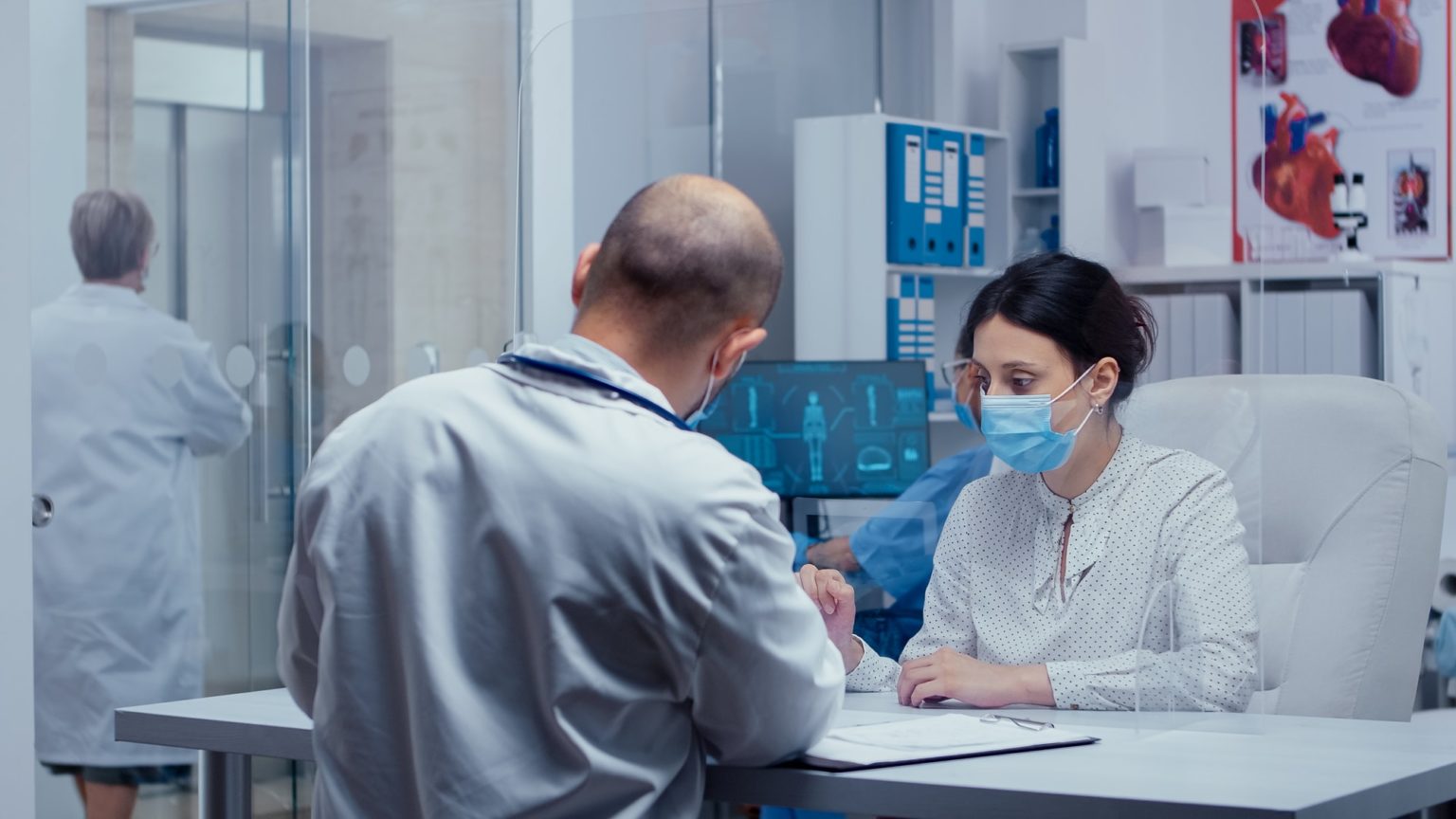 Woman at doctor appointment during COVID-19